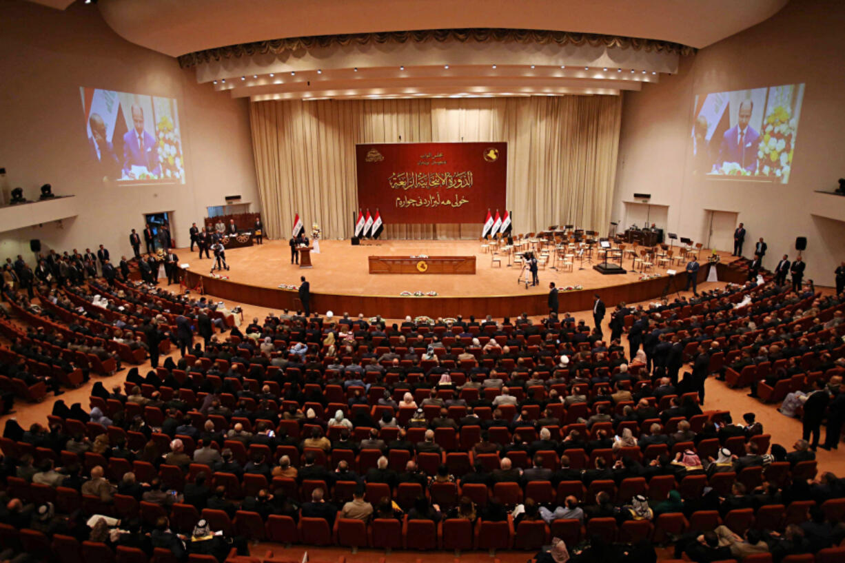 FILE - Iraqi lawmakers attend a parliament session in Baghdad, Iraq, on Sept. 3, 2018. Iraqi lawmakers passed early Monday March 27, 2023 a controversial amendment to the elections law that could hinder opportunities for smaller parties and independent candidates to win seats in future polls.