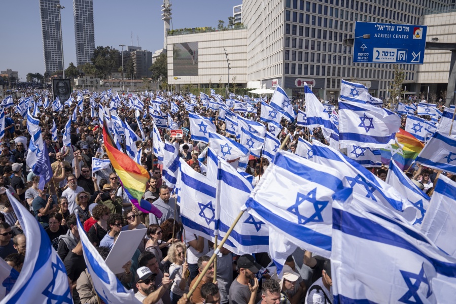 Israelis protest against plans by Prime Minister Benjamin Netanyahu's new government to overhaul the judicial system, in Tel Aviv, Israel, Wednesday, March 1, 2023.