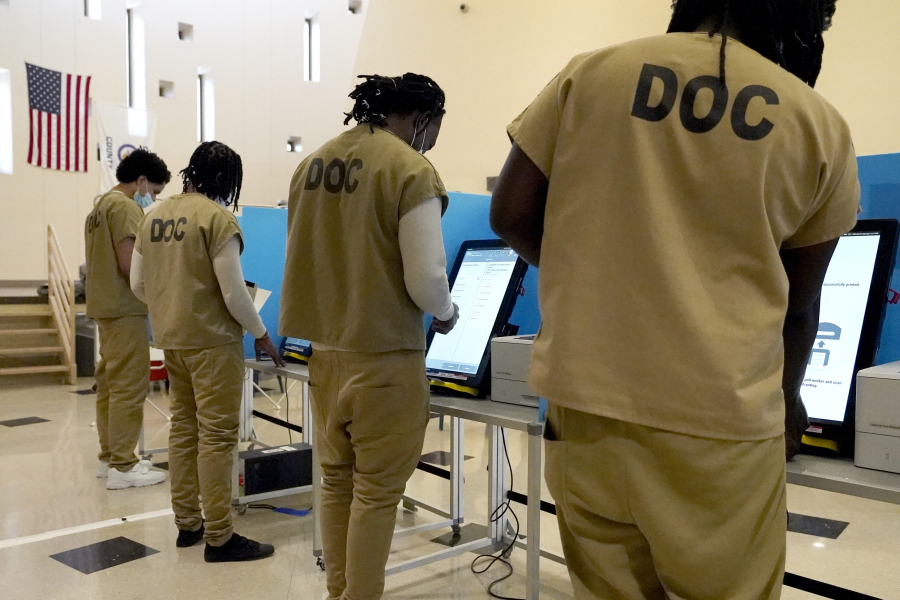 Inmates at the Cook County, Ill., jail vote in a local election at the jail's Division 11 Chapel on Saturday, Feb. 18, 2023, in Chicago.