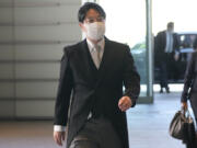 FILE - Newly appointed Minister of State for Measures for Declining Birthrate Masanobu Ogura arrives at the prime minister's office on Aug. 10, 2022, in Tokyo. Ogura, the Japanese minister in charge of tackling declining birthrates unveiled a draft proposal Friday, March 31, 2023, aimed at reversing the downtrend, including increased subsidies for childrearing and education and a salary increase for younger generations to incentivize marrying and having kids.