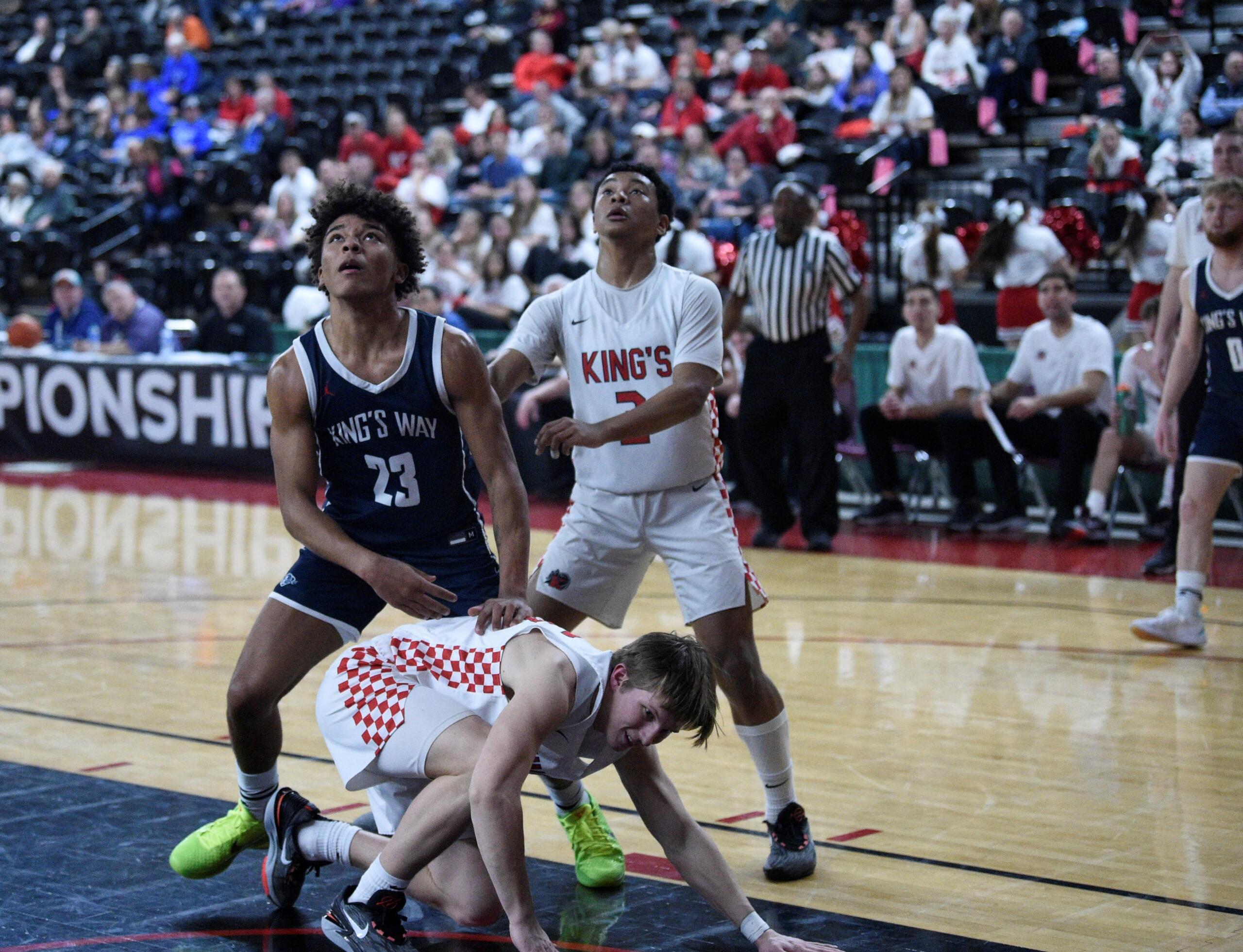 King’s Way Christian’s Jamison Duke (23) battles for a rebound against King’s during the first half of a Class 1A boys basketball state tournament game on Wednesday, March 1, 2023 in Yakima.