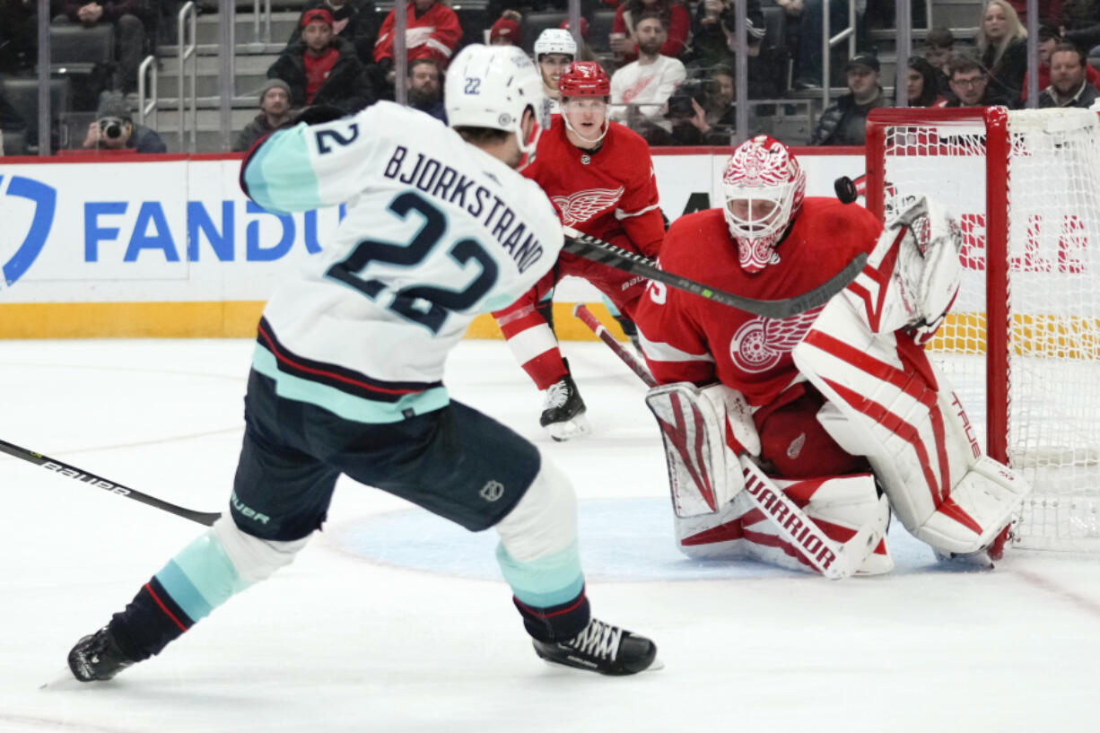 Detroit Red Wings goaltender Ville Husso (35) stops a Seattle Kraken right wing Oliver Bjorkstrand (22) shot in the third period of an NHL hockey game Thursday, March 2, 2023, in Detroit.