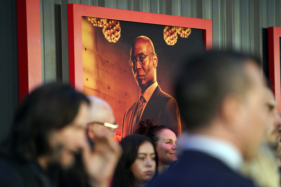 A poster of the late Lance Reddick, a cast member in "John Wick: Chapter 4," hangs on a backdrop at the premiere of the film, Monday, March 20, 2023, at the TCL Chinese Theatre in Los Angeles. The veteran character actor Reddick died early Friday at age 60.