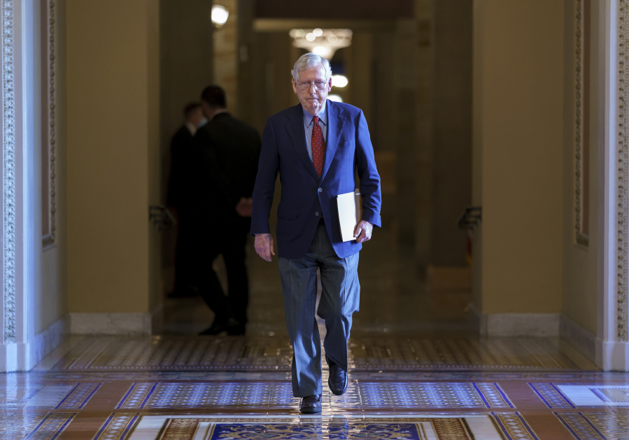 FILE - Senate Minority Leader Mitch McConnell, R-Ky., walks to the chamber for a test vote on a government spending bill, at the Capitol in Washington, Monday, Sept. 27, 2021. McConnell, 81, has been hospitalized after tripping and falling at a hotel as he was attending a private dinner at a Washington hotel Wednesday night, March 8, 2023. (AP Photo/J.