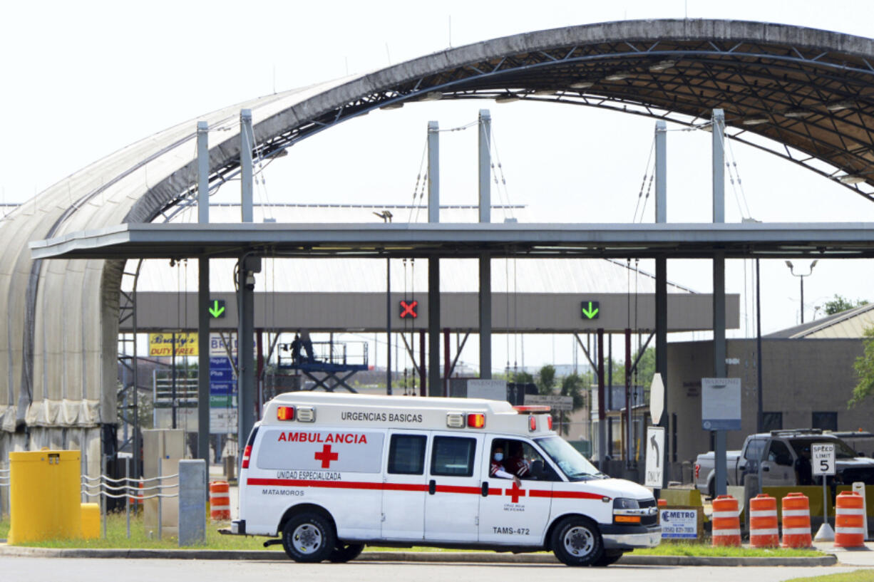 FILE - A Mexican Red Cross ambulance transports two Americans found alive after their abduction in Mexico through Veterans International Bridge at Los Tomates in Brownsville, Texas, on March 7, 2023. A man who admitted to purchasing firearms that he knew would be going from the U.S. to a Mexican drug cartel has been arrested in Texas after the discovery that one of the weapons was linked to the deadly kidnapping of four Americans in the border city of Matamoros, according federal court records, Saturday, March 18.