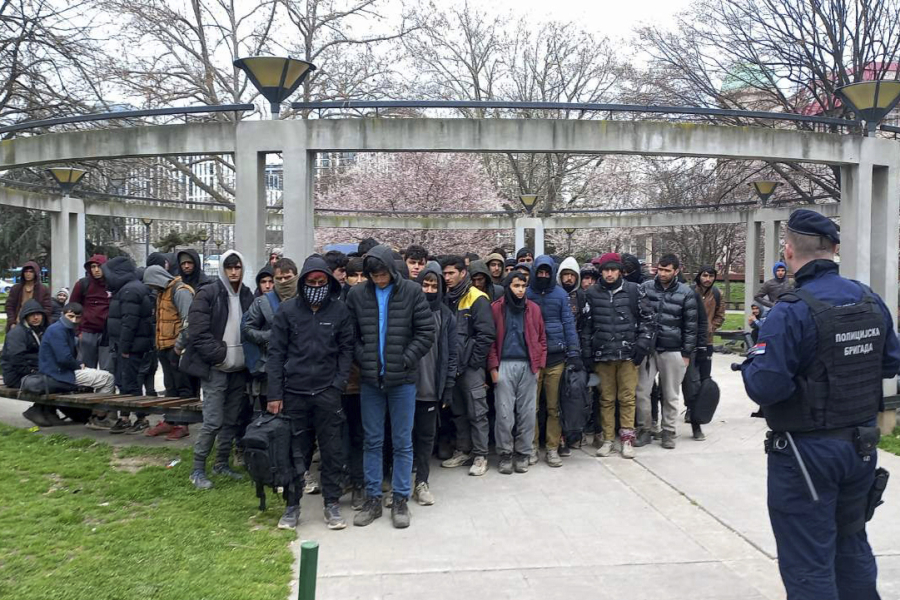 In this photo provided by the Serbian Ministry of Interior, a group of migrants detained by Serbian police officers in Belgrade, Serbia, Wednesday, March 15, 2023. European Union's top security official on Thursday praised Serbia's handling of migration through the Balkan country which lies at the heart of the so-called Balkan route and shares borders with EU neighbors.