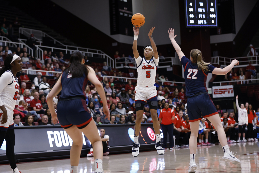 Mississippi forward Snudda Collins (5) shoots a 3-pointer against Gonzaga guard Brynna Maxwell (22) during the first half of a first-round college basketball game in the women's NCAA Tournament in Stanford, Calif., Friday, March 17, 2023.