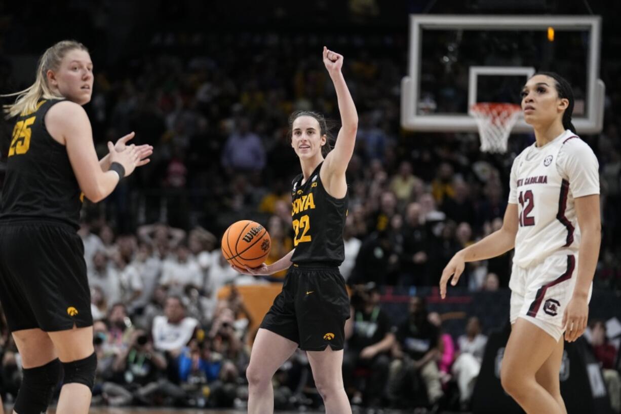 Iowa's Caitlin Clark reacts after being fouled in the final second of the second half of an NCAA Women's Final Four semifinals basketball game against South CarolinaFriday, March 31, 2023, in Dallas.