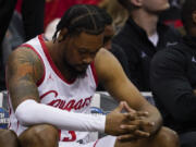 Houston forward J'Wan Roberts sits on the bench during their loss against Miami in a Sweet 16 college basketball game in the Midwest Regional of the NCAA Tournament Friday, March 24, 2023, in Kansas City, Mo.