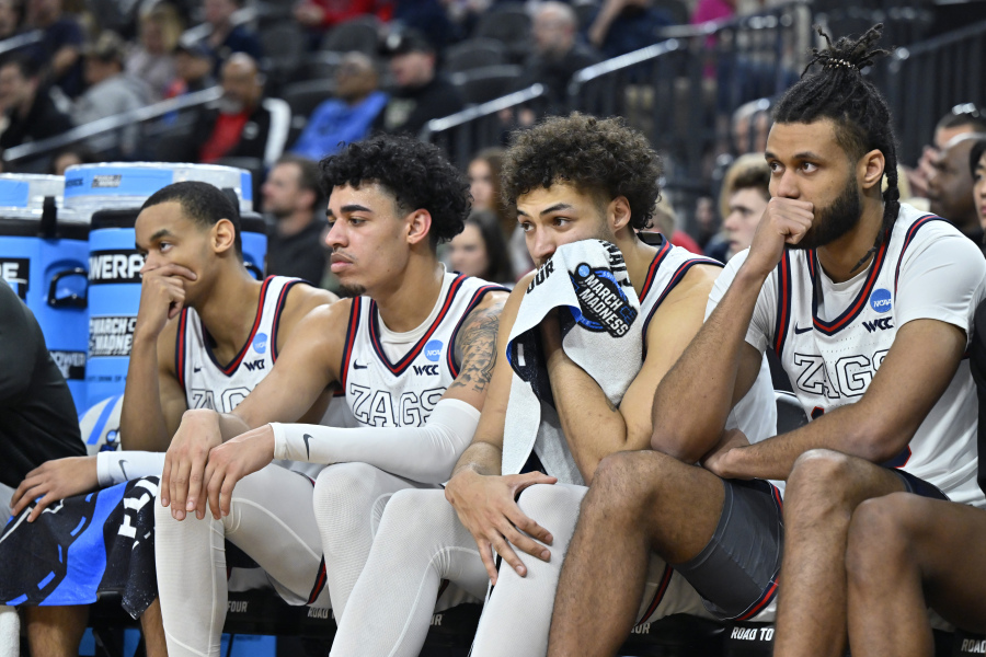 Gonzaga players react from the bench in the second half of an Elite 8 college basketball game against UConn in the West Region final of the NCAA Tournament, Saturday, March 25, 2023, in Las Vegas.