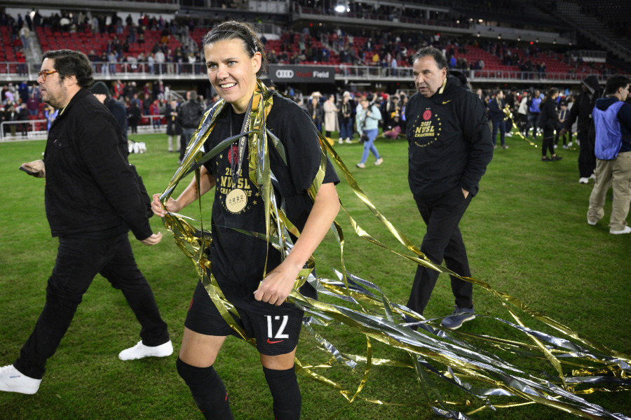 FILE - Portland Thorns FC forward Christine Sinclair (12) celebrates after the NWSL championship soccer match against the Kansas City Current, Saturday, Oct. 29, 2022, in Washington. The Portland Thorns' Christine Sinclair is one of just five players who helped launch the National Women's Soccer League in 2013 and are still with their same teams.