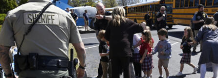 Students from The Covenant School get off a bus to meet their parents at the reunification site at the Woodmont Baptist Church Monday, March 27, 2023, in Nashville, Tenn. following a mass shooting at their school, where three children and three adults were killed by a perpetrator that was killed by police at the scene.