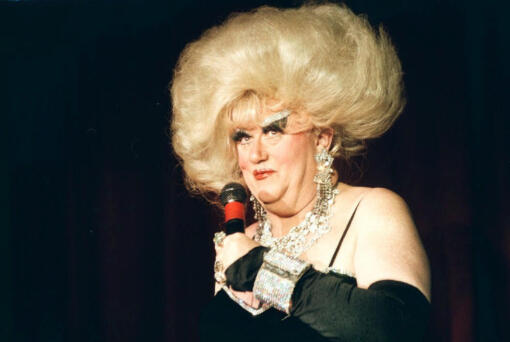 FILE -  Darcelle appears on stage at Cole's Portland, Ore. nightclub Darcelle XV during a show on Dec. 3, 1998. Walter C. Cole, better known as the iconic drag queen who performed for decades as Darcelle, has died of natural causes in Portland, Ore, on Thursday, March 24, 2023.