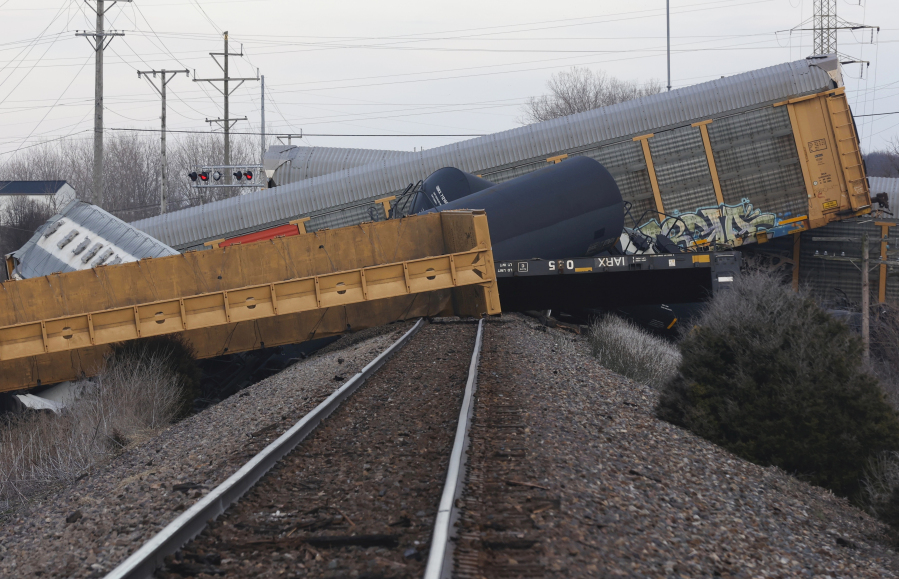 Multiple cars of a Norfolk Southern train lie toppled after derailing at a train crossing with Ohio 41 in Clark County, Ohio, Saturday, March 4, 2023.
