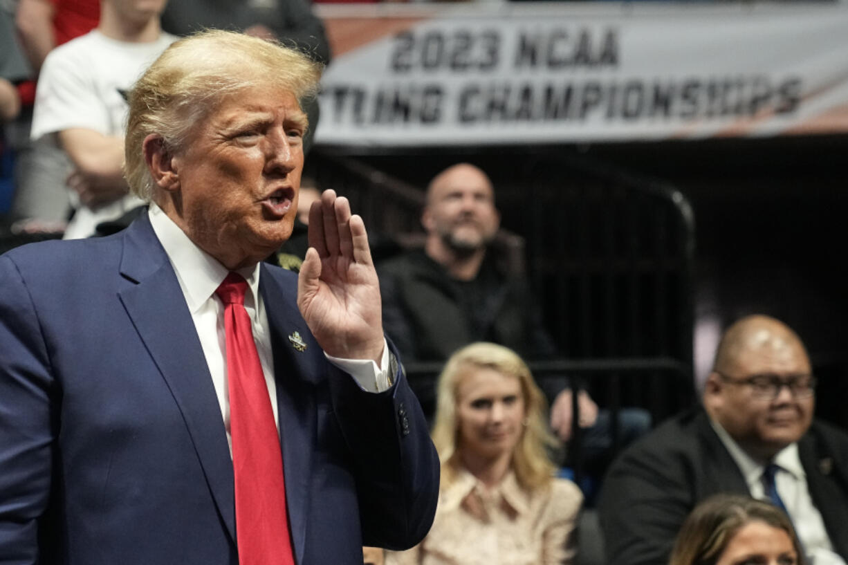 Former President Donald J. Trump watches the NCAA Wrestling Championships, Saturday, March 18, 2023, in Tulsa, Okla.