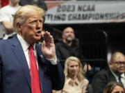 Former President Donald J. Trump watches the NCAA Wrestling Championships, Saturday, March 18, 2023, in Tulsa, Okla.