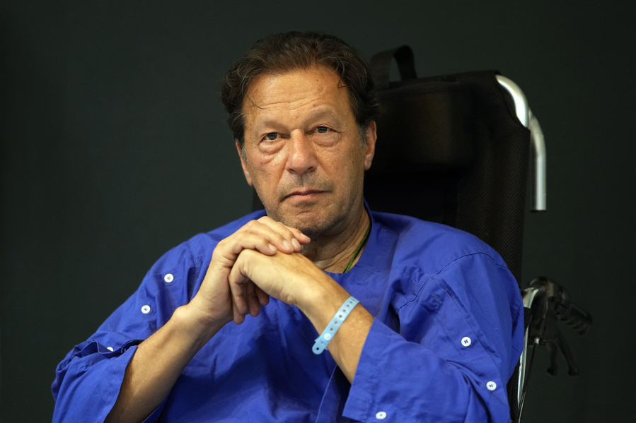 FILE - Former Pakistani Prime Minister Imran Khan speaks during a news conference in Shaukat Khanum hospital, where is being treated for a gunshot wound in Lahore, Pakistan, on Nov. 4, 2022.  Pakistani police used water cannons and fired tear gas to disperse supporters of Khan Wednesday, March 8, 2023,  in the eastern city of Lahore. Two dozen Khan supporters were arrested for defying a government ban on holding rallies, police said. (AP Photo/K.M.