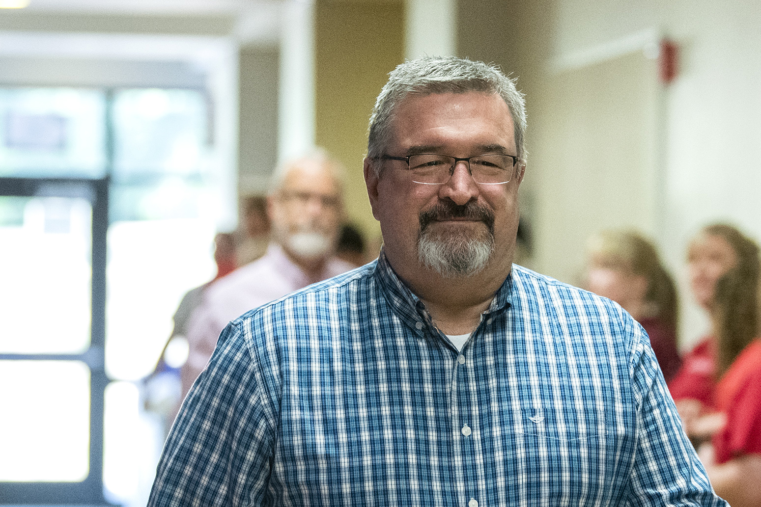 La Center Superintendent Peter Rosenkranz walks down a hallway lined at La Center High School in 2019.
