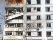 In this grab taken from video provided by Ukrainian Presidential Office, a residential multi-story building hit by a missile is on fire in southeastern city of Zaporizhzhia, Ukraine, Wednesday, March 22, 2023.