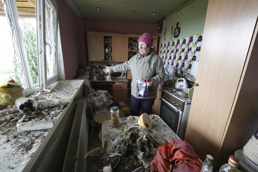Tetiana Iegorova, 55,  shows the kitchen of her house which was damaged by a Russian rocket attack, in Kharkiv, Ukraine, Friday, March 31, 2023.
