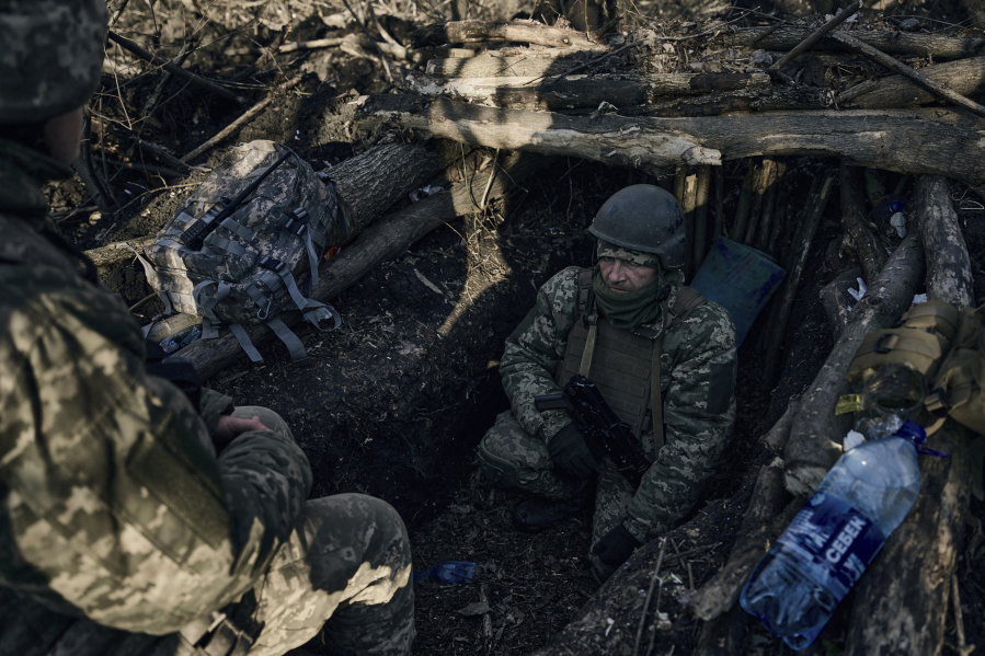 Ukrainian soldiers in a trench near Russian positions close to Bakhmut, Donetsk region, Ukraine, Sunday, March 5, 2023.
