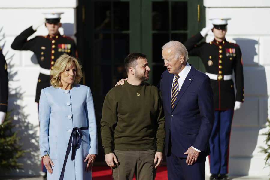 FILE - President Joe Biden welcomes Ukraine's President Volodymyr Zelenskyy at the White House in Washington, Wednesday, Dec. 21, 2022. A year ago, with Russian forces bearing down on Ukraine's capital, Western leaders feared for the life of President Volodymyr Zelenskyy and the U.S. offered him an escape route. Zelenskyy declined, declaring his intent to stay and defend Ukraine's independence.