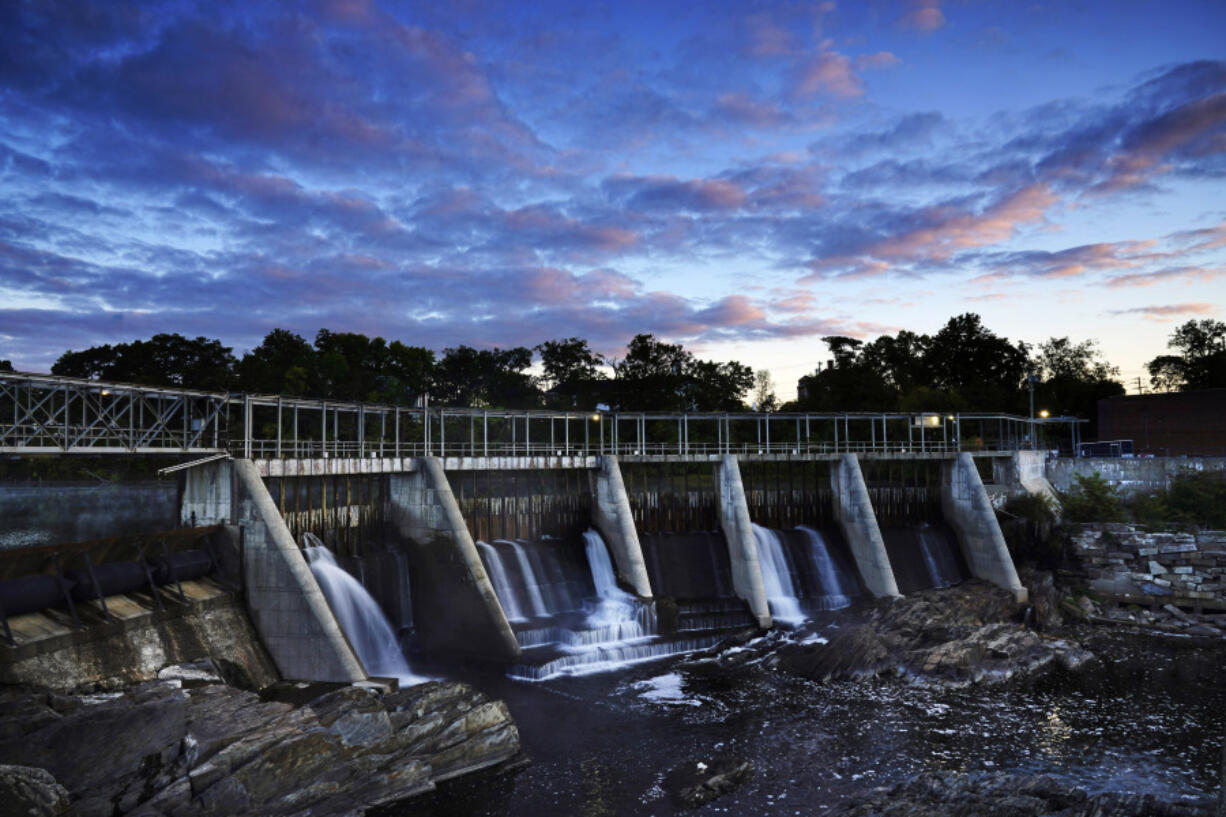 The Weston Dam holds back the Kennebec River on Sept. 14, 2021, in Skowhegan, Maine. The federal government ruled Monday that the last wild Atlantic salmon in the country can coexist with dams on a Maine river, dealing a blow to environmentalists who have long sought to remove them.