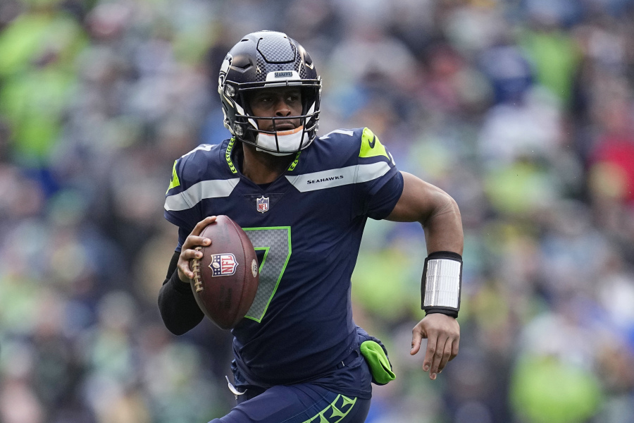 Seattle Seahawks quarterback Geno Smith finally got to enjoy a day of being in the spotlight after signing the big contract that had eluded most of his career. Smith's three-year contract with the Seahawks will keep him as the presumptive starting quarterback in Seattle following a breakout season.