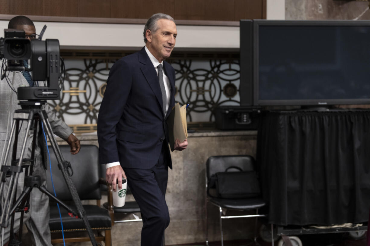 Longtime Starbucks CEO Howard Schultz arrives at a crowded Senate Health, Education, Labor and Pensions Committee hearing room where he expects to face sharp questioning about the company's actions during an ongoing unionizing campaign, at the Capitol in Washington, Wednesday, March 29, 2023. (AP Photo/J.