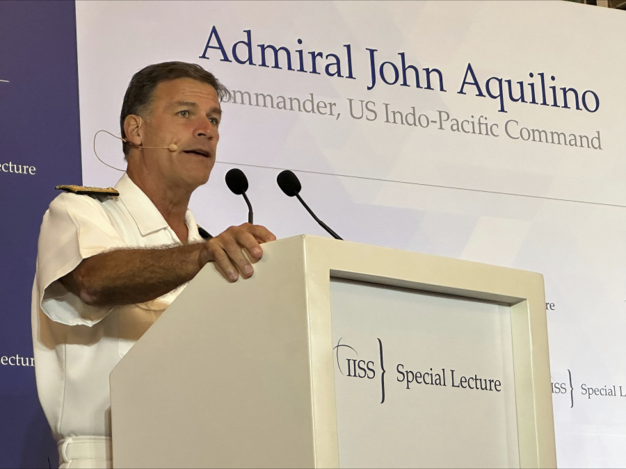 In this photo released by IISS on Thursday, March 16, 2023, Admiral John Aquilino delivers a speech at a think tank in Singapore where he will speak on the topic of 'Managing Strategic Competition and the Quest for an Enduring Future in the Indo-Pacific. United States Indo-Pacific Command chief Adm. John Aquilino said Thursday that Washington does not seek to contain China, nor seek conflicts in the region, but it would take action to support the region against coercion and bullying by authoritarian regimes.