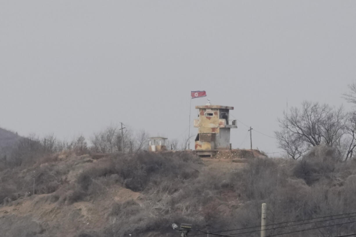A North Korean flag flutters in the wind at a military guard post seen from Paju, South Korea, Tuesday, March 14, 2023. North Korea test-fired two short-range ballistic missiles in another show of force Tuesday, a day after the United States and South Korea began military drills that Pyongyang views as an invasion rehearsal.