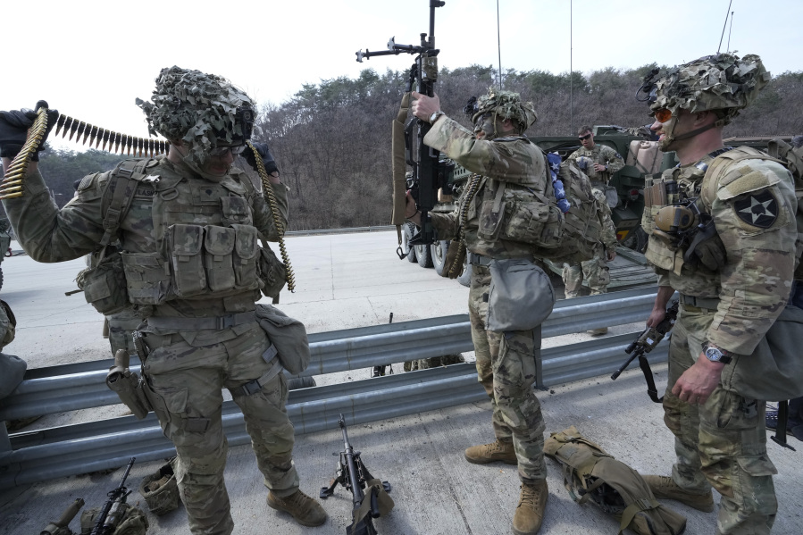 U.S. Army soldiers prepare to participate in a combined live fire exercise between South Korea and the United States at Rodriguez Live Fire Complex in Pocheon, South Korea, Wednesday, March 22, 2023. North Korea launched multiple cruise missiles toward the sea on Wednesday, South Korea's military said, three days after the North carried out what it called a simulated nuclear attack on South Korea.