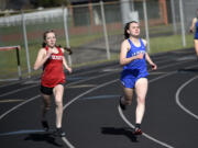 Casie Kleine of Castle Rock (left) and Shaela Bradley of La Center race the final turn in the girls 400 meters at the Tiger Relays at Battle Ground High School on Saturday, March 25, 2023. Kleine would go on to finish first just ahead of Bradley.