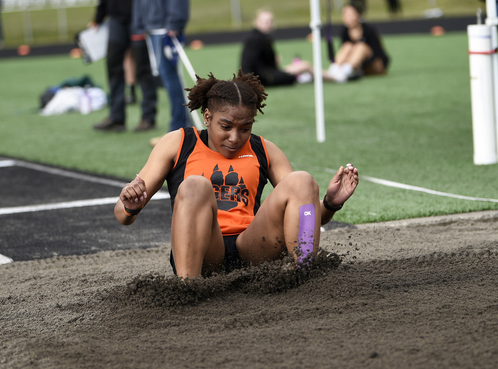 Faizah Ford of Battle Ground hits the sand on her way to winning the girls triple jump at the Tiger Relays at Battle Ground High School on Saturday, March 25, 2023.