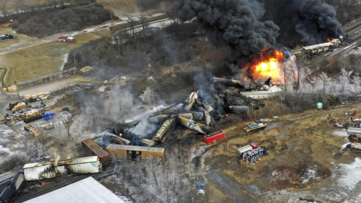 FILE - This photo taken with a drone shows portions of a Norfolk Southern freight train that derailed Feb. 3, in East Palestine, Ohio, are still on fire on Feb. 4, 2023.   (AP Photo/Gene J.