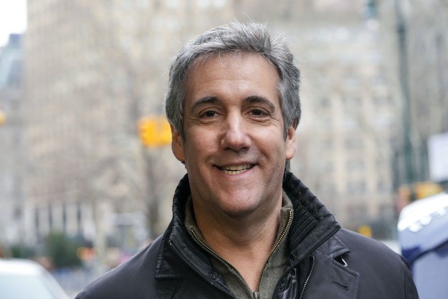 Michael Cohen smiles as he leaves a lower Manhattan building after meeting with prosecutors, Friday, March 10, 2023, in New York.