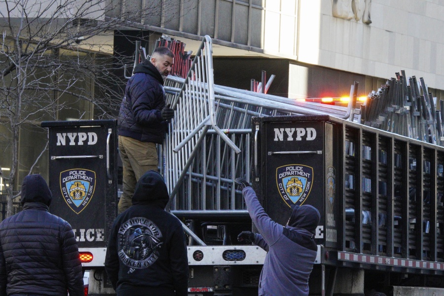 New York Police Officers move barricades near the courthouse ahead of former President Donald Trump's anticipated indictment  on Monday, March 20, 2023, in New York.