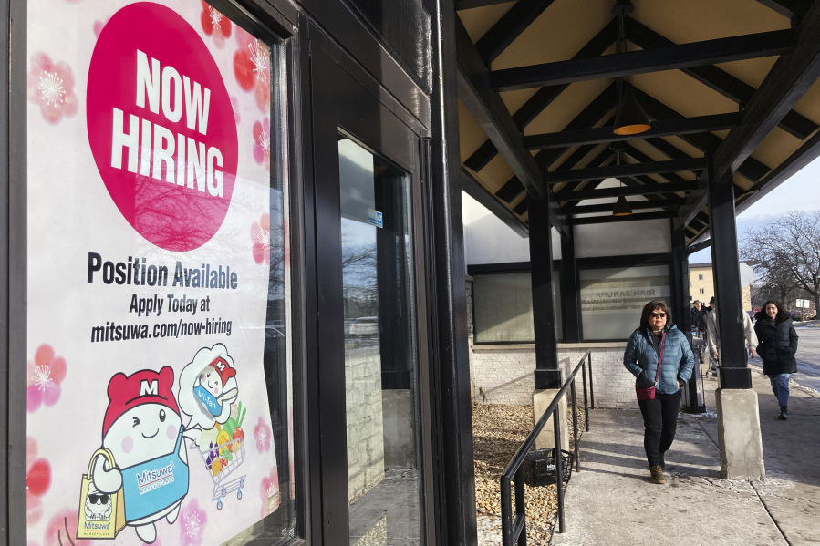 File - A hiring sign is displayed at a grocery store in Arlington Heights, Ill., Tuesday, Dec. 27, 2022. On Thursday, the Labor Department reports on the number of people who applied for unemployment benefits last week. (AP Photo/Nam Y.