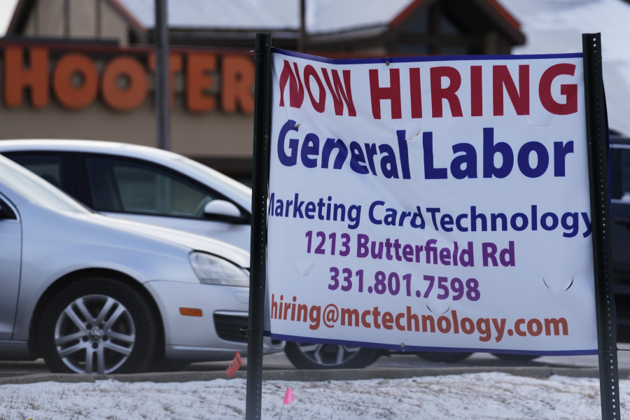 File - A hiring sign is seen in Downers Grove, Ill., Thursday, May 5, 2022. On Thursday, the Labor Department reports on the number of people who applied for unemployment benefits last week. (AP Photo/Nam Y.