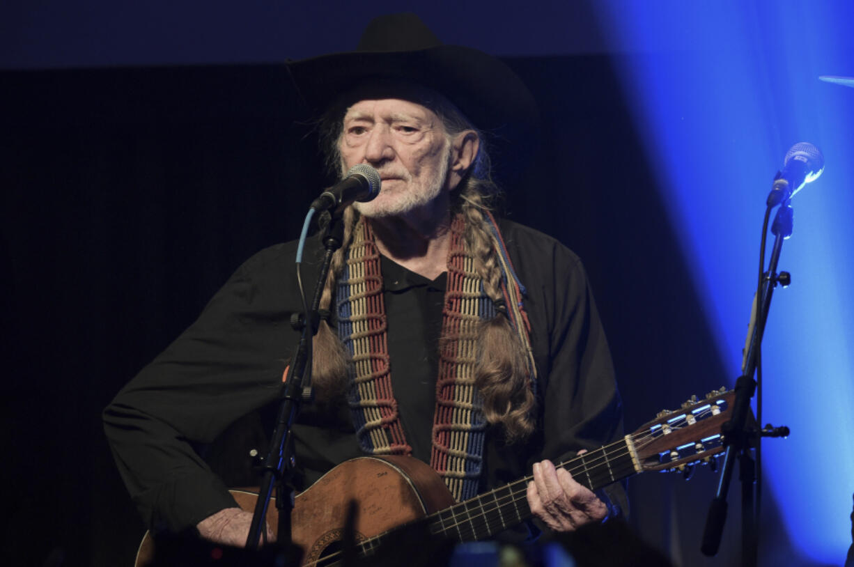 FILE - Willie Nelson performs at the Producers & Engineers Wing 12th Annual Grammy Week Celebration at the Village Studio in Los Angeles, on Feb. 6, 2019. Weeks after winning more Grammys, Nelson is getting a new kind of honor: a university endowment in Texas. The 89-year-old country music icon, who in the 1980s helped launch the Farm Aid benefit concerts, is the namesake of the new Willie Nelson Endowment for Uplifting Rural Communities at the University of Texas' LBJ School of Public Affairs.