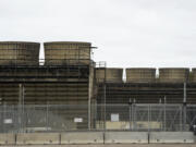 FILE - Cooling towers release heat generated by boiling water reactors at Xcel Energy's Nuclear Generating Plant on Oct. 2, 2019, in Monticello, Minn. Minnesota regulators said Thursday, March 16, 2023, that they're monitoring the cleanup of a leak of 400,000 gallons of radioactive water from Xcel Energy's Monticello nuclear power plant in late November 2022. The company said there's no danger to the public.