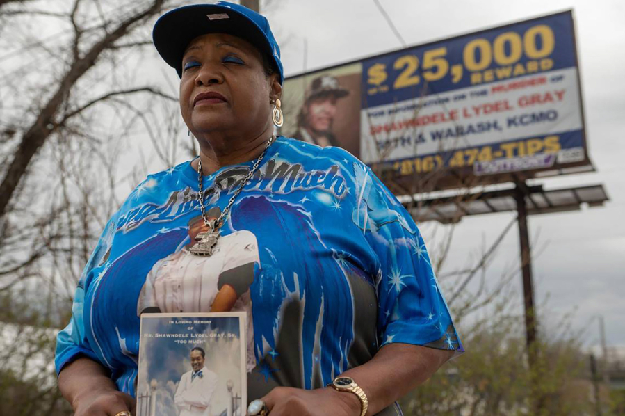 Sherry Paige holds a photo of her son on March 30, 2023, in Kansas City. Paige commissioned a billboard hoping to seek justice for the death of her son, Shawndele Lyle Gray, who was found shot inside his vehicle two years ago.