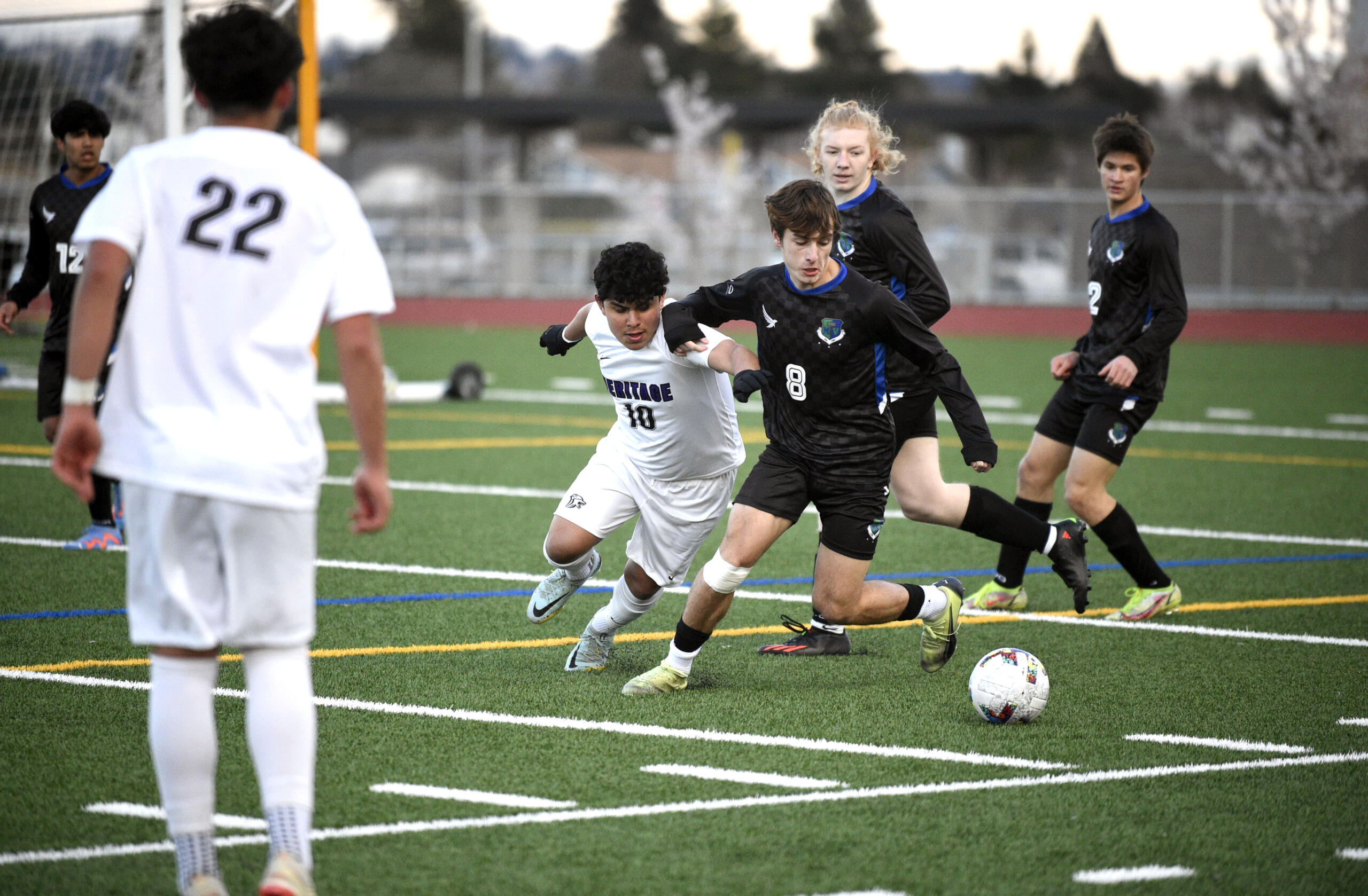 Heritage’s Pablo Barbosa-Sanchez (10) and Mountain View’s Emin Music (8) battle for possession of the ball during a 3A Greater St. Helens League boys soccer game on Tuesday, April 11, 2023, at Mountain View High School.