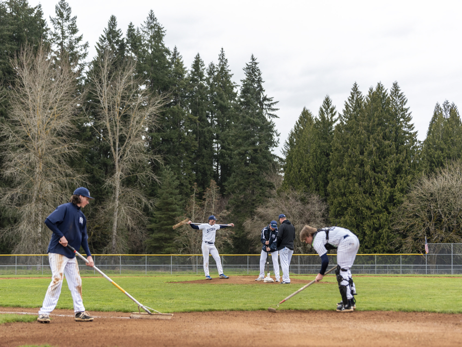 Skyview players tend to the field on April 5 after the Storm's 6-2 win against Prairie. It was Skyview's first game at its home stadium in 7 years.