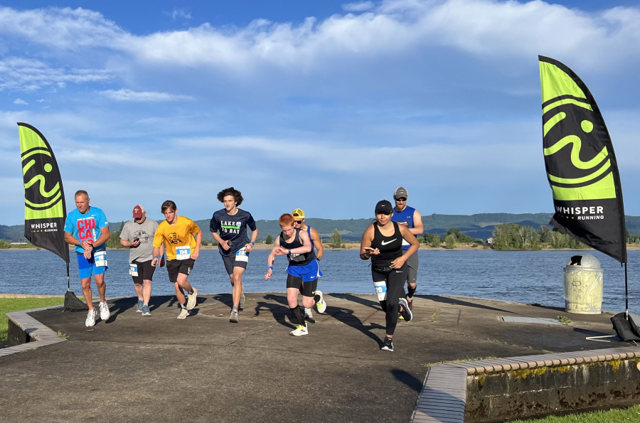 A wave of participants in the 2022 Lake to Bay start the first leg of the relay at Frenchman's Bar Regional Park along the Columbia River in Vancouver.