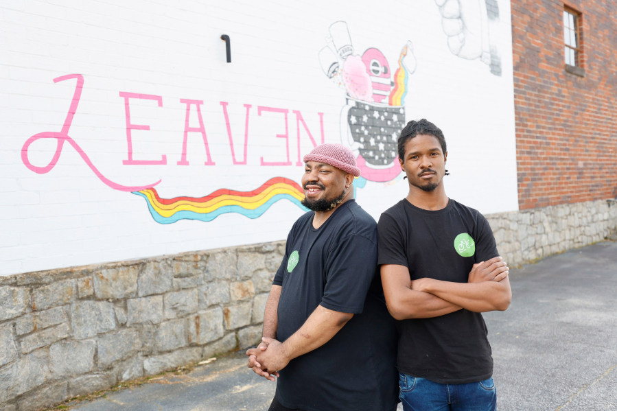 Nijil Jones (right) and Antonio Little pose outside Leaven Kitchen on Thursday, April 13, 2023. They and another four members co-own a Pecan Milk Cooperative that produces milk for local markets.