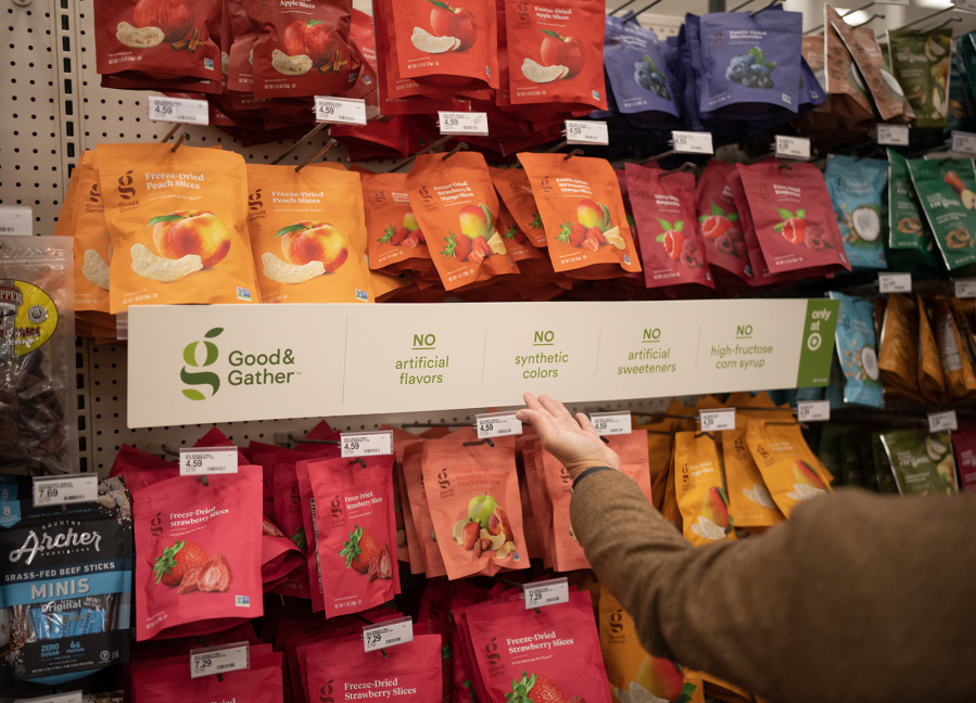 Chief Food and Beverage Officer Rick Gomez highlighted shelves stocked with the Target owned brand of healthy snacks, "Good & Gather," during a tour of the Target Store in Plymouth, Minnesota on Wednesday, March 8, 2023.