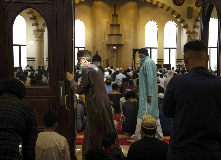 Worshippers gather for Jummah prayers at Darussalam mosque in Lombard on April 14, 2023. (E.