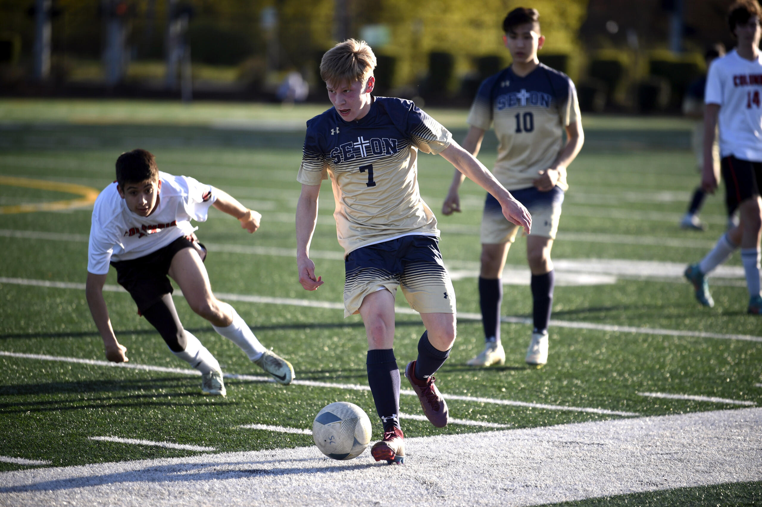 Seton Catholic’s Eli Wall looks up the field while dribbling the ball during a Trico League boys soccer game on Tuesday, April 25, 2023, at Seton Catholic High School.