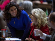 Majority Floor Leader Rep. Monica Stonier, D-Vancouver, left, talks with Minority Floor Leader, Republican Rep. Jacquelin Maycumber, center, and Republican Rep. Morgan Irwin, right, during a previous session in Olympia.